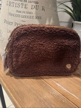 lululemon brown sherpa pouch with gold zipper tag NWT
